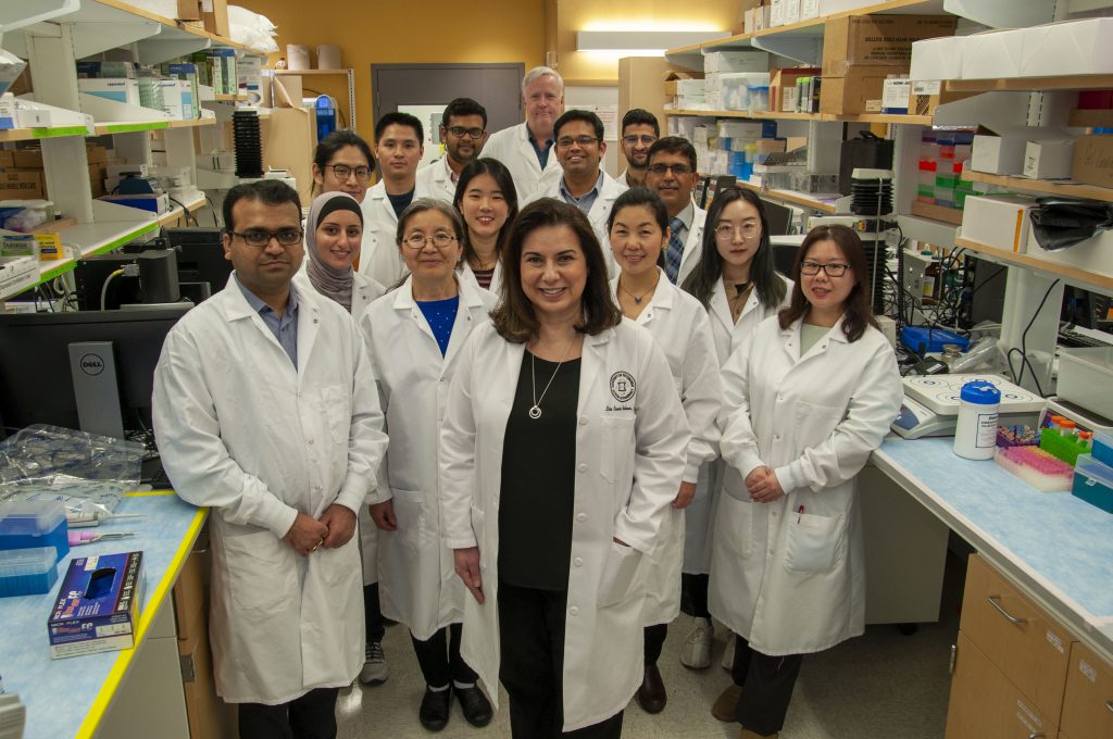 Lisa Rohan (center) with group of lab associates